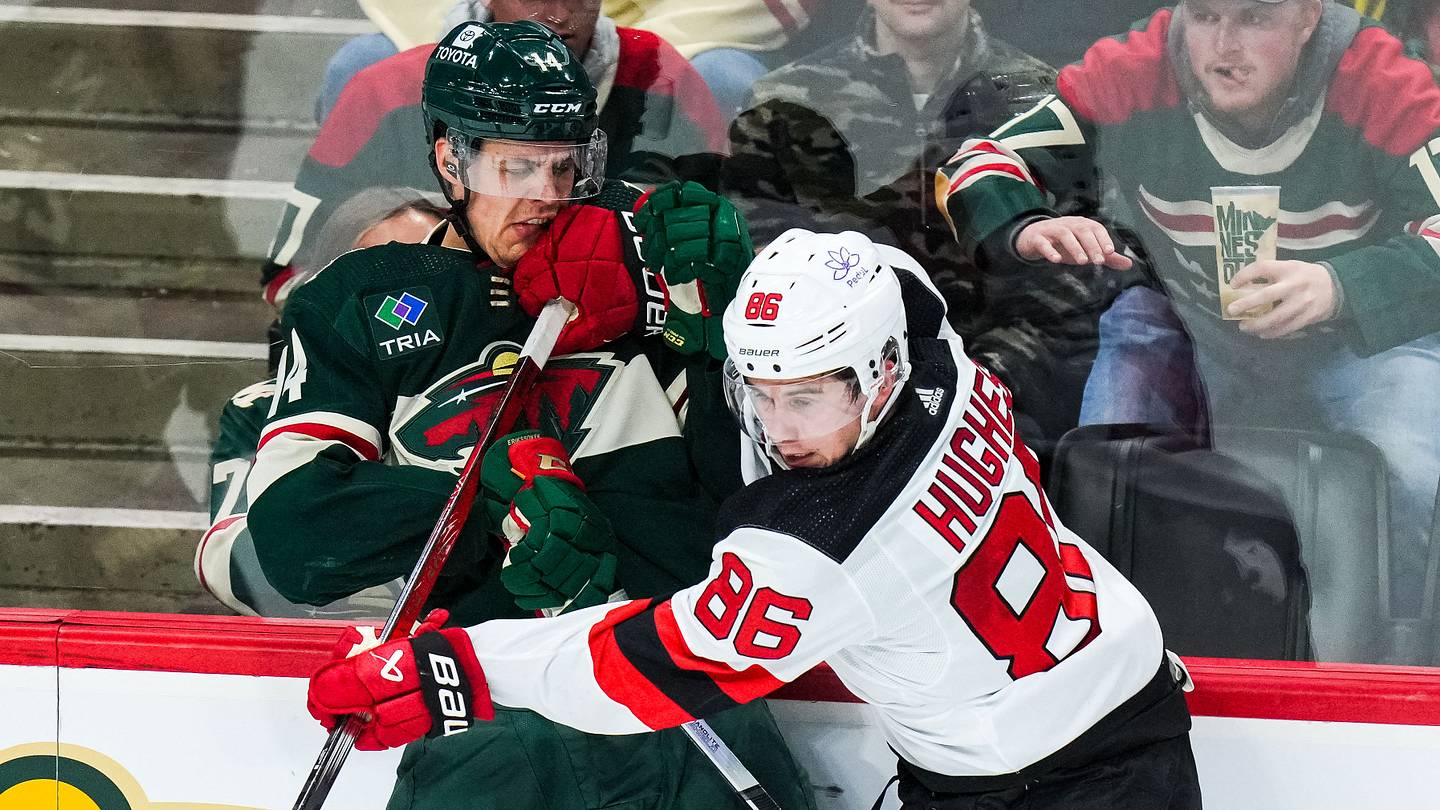 New Jersey Devils center Jack Hughes (86) hits Minnesota Wild center Joel Eriksson Ek (14): Brace Hemmelgarn-USA TODAY Sports