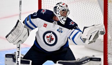 Apr 2, 2026; Dallas, Texas, USA; Winnipeg Jets goaltender Connor Hellebuyck (37) makes a glove save on a Dallas Stars shot during the second period at the American Airlines Center. Mandatory Credit: Jerome Miron-Imagn Images