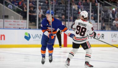 Mar 24, 2026; Elmont, New York, USA; New York Islanders defenseman Matthew Schaefer (48) follows through on a shot against Chicago Blackhawks center Connor Bedard (98) during the first period at UBS Arena. Mandatory Credit: Brad Penner-Imagn Images