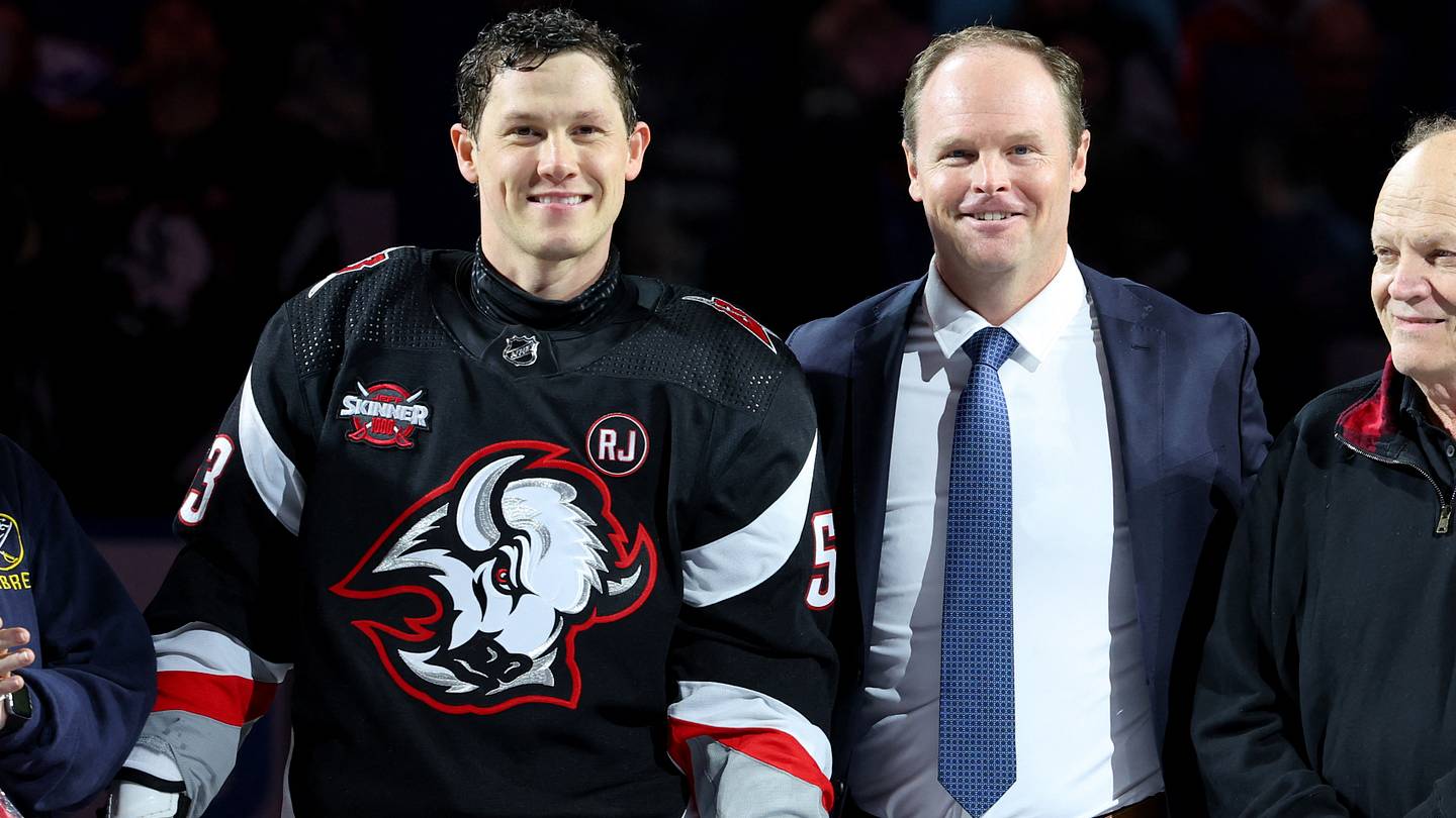 Former Buffalo Sabres general manager Kevyn Adams alongside Jeff Skinner