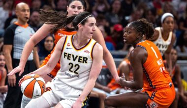 Jul 22, 2026; Indianapolis, Indiana, USA; Indiana Fever guard Caitlin Clark (22) dribbles the ball while Connecticut Sun forward Diamond Miller (1) defends in the second half at Gainbridge Fieldhouse. Mandatory Credit: Trevor Ruszkowski-Imagn Images