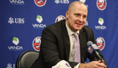 Nov 22, 2025; Elmont, New York, USA; New York Islanders General Manager Mathieu Darche speaks with fans at a pre-game event prior to the game against the St. Louis Blues at UBS Arena. Mandatory Credit: Wendell Cruz-Imagn Images