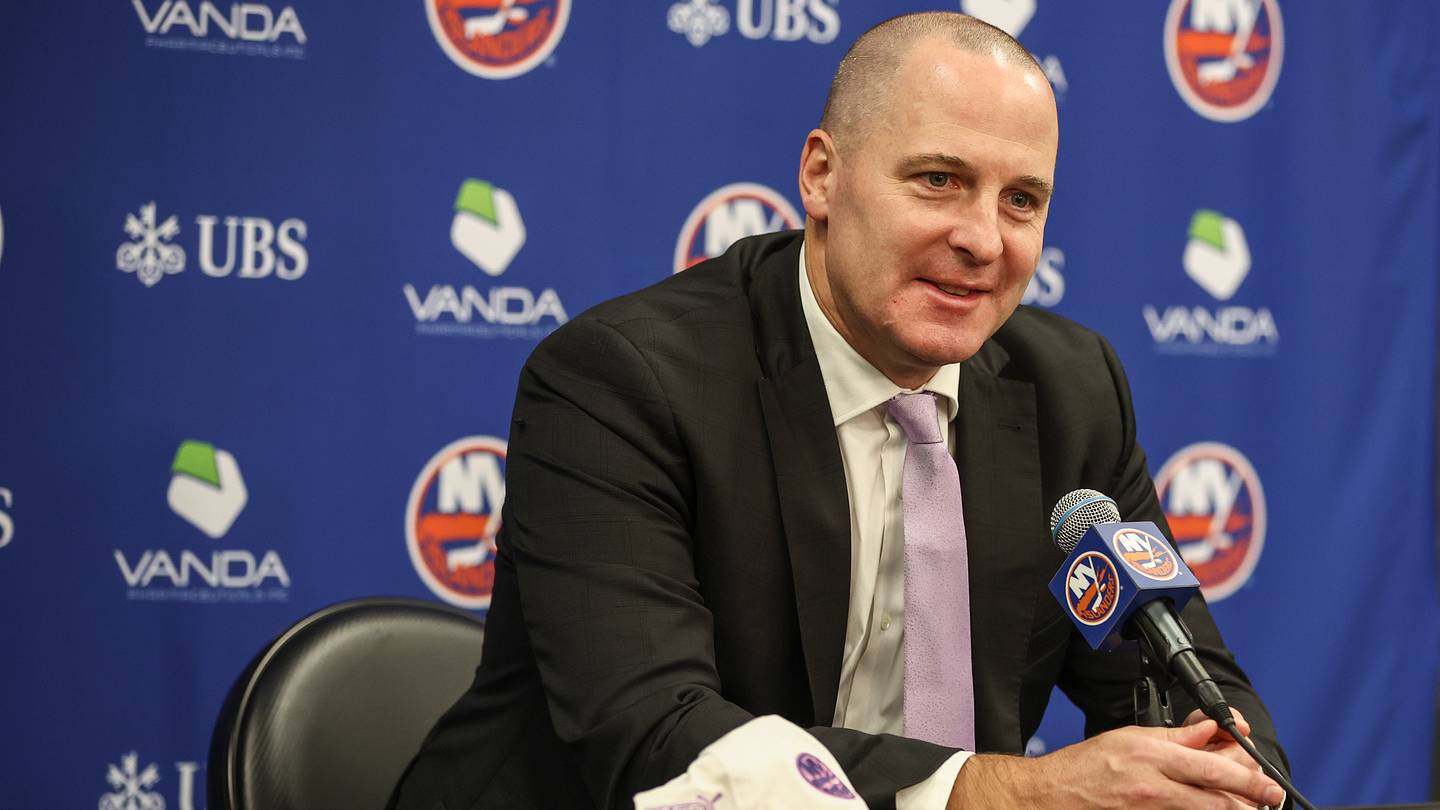 Nov 22, 2025; Elmont, New York, USA; New York Islanders General Manager Mathieu Darche speaks with fans at a pre-game event prior to the game against the St. Louis Blues at UBS Arena. Mandatory Credit: Wendell Cruz-Imagn Images
