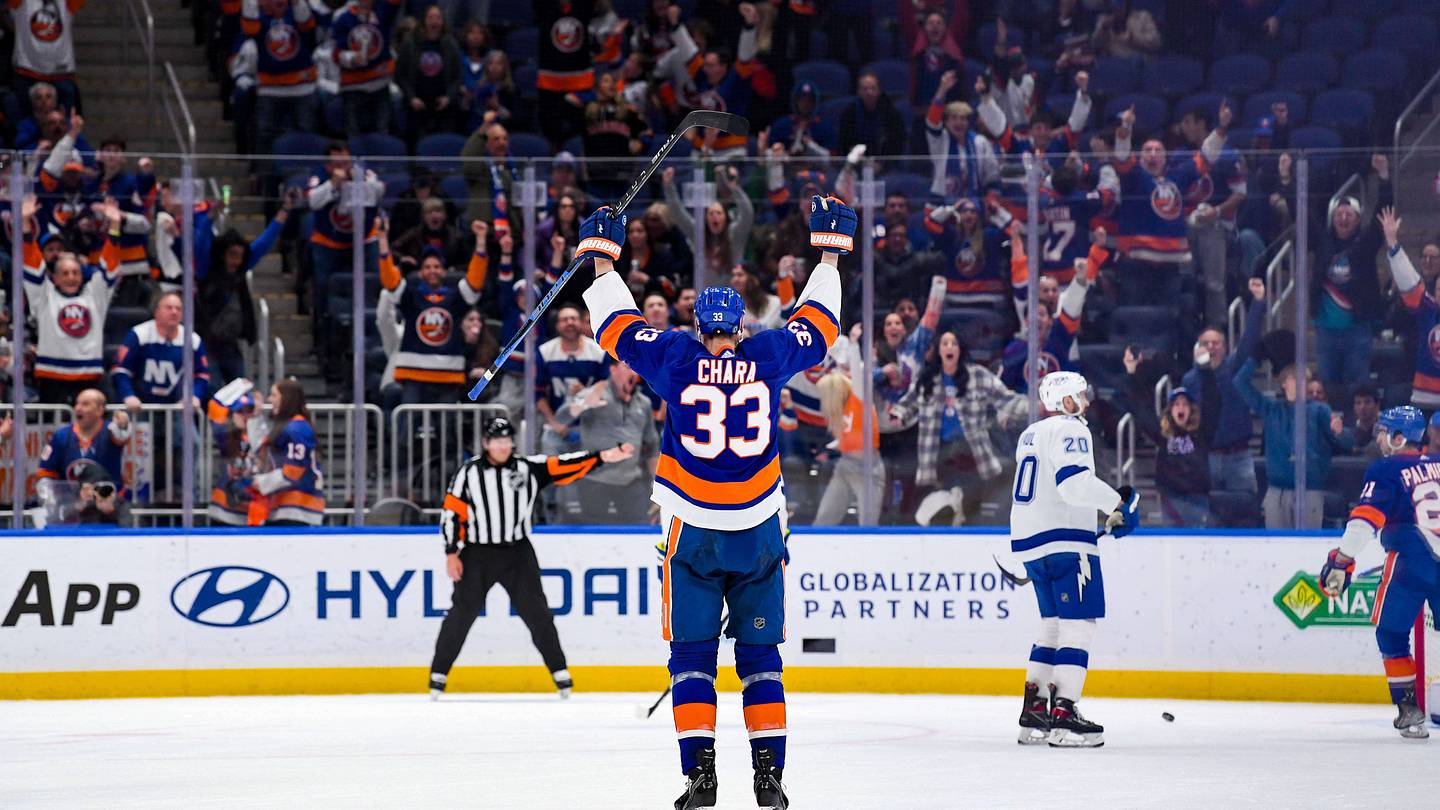 Apr 29, 2022; Elmont, New York, USA; New York Islanders defenseman Zdeno Chara (33) scores a goal against the Tampa Bay Lightning during the third period at UBS Arena. Mandatory Credit: Dennis Schneidler-USA TODAY Sports