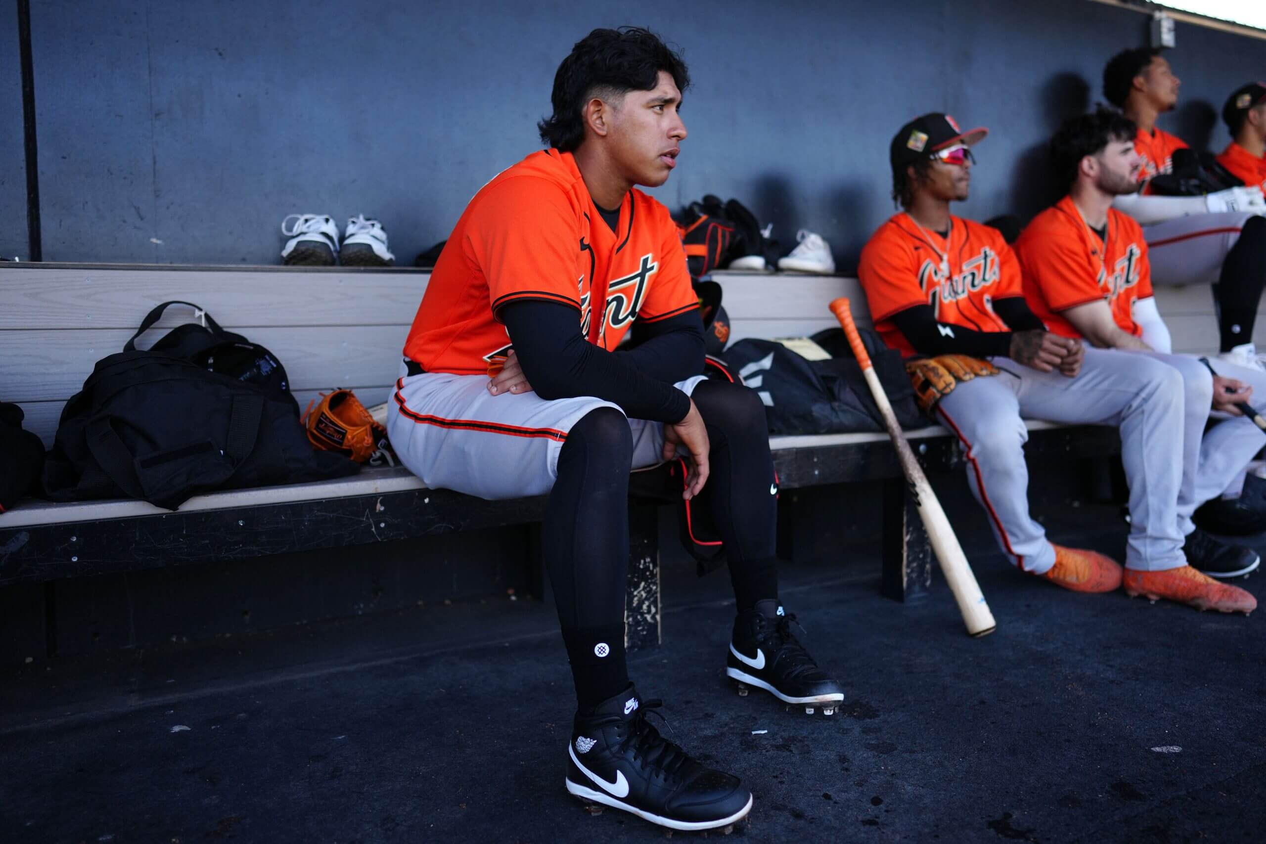 Luis Hernandez sits in the dugout.