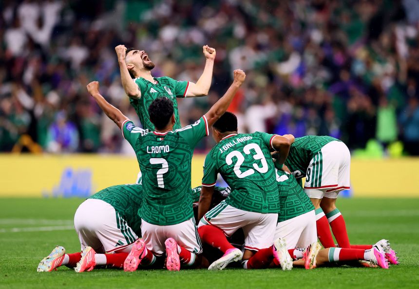 Mexico's Raul Jimenez celebrates scoring their second goal against Ecaudor.