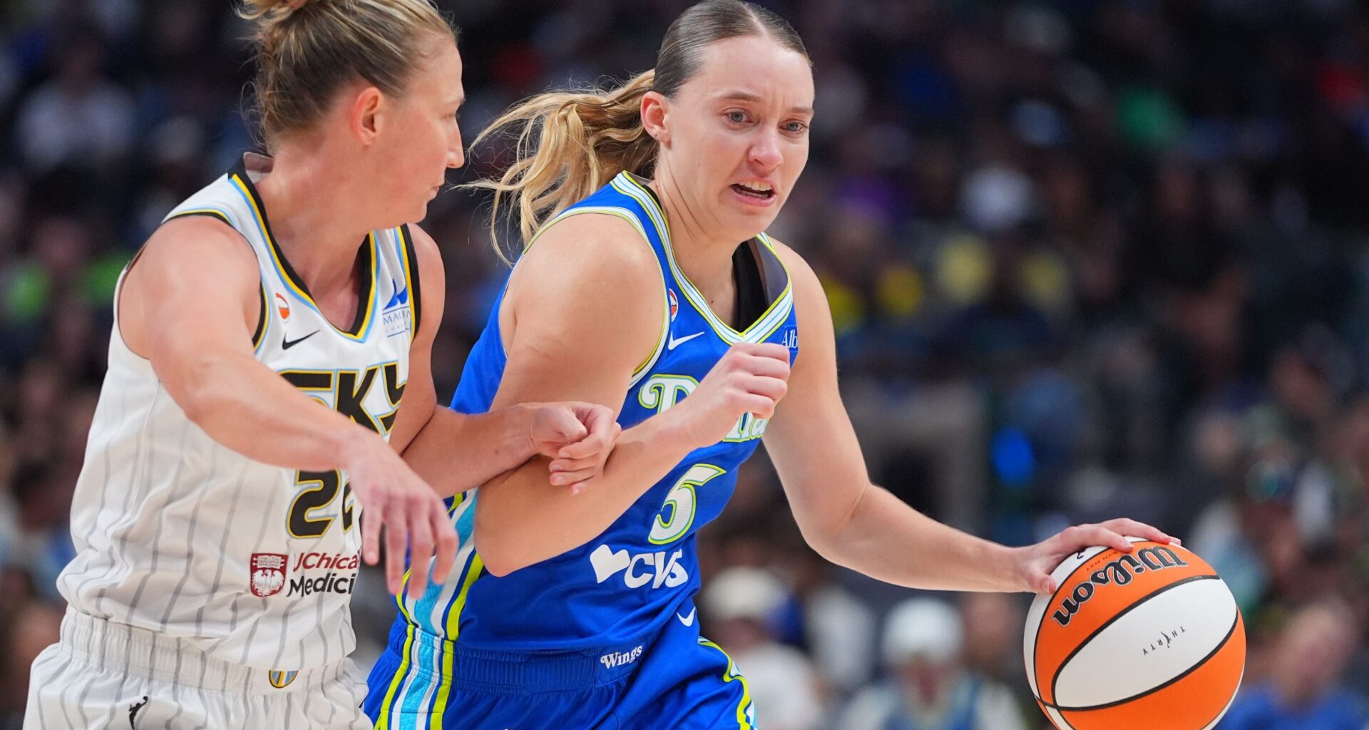 Dallas Wings guard Paige Bueckers, right, drives against Chicago Sky guard Courtney Vandersloot, left, during the second half of a WNBA basketball game in Dallas, Sunday, July 12, 2026. (AP Photo/LM Otero)