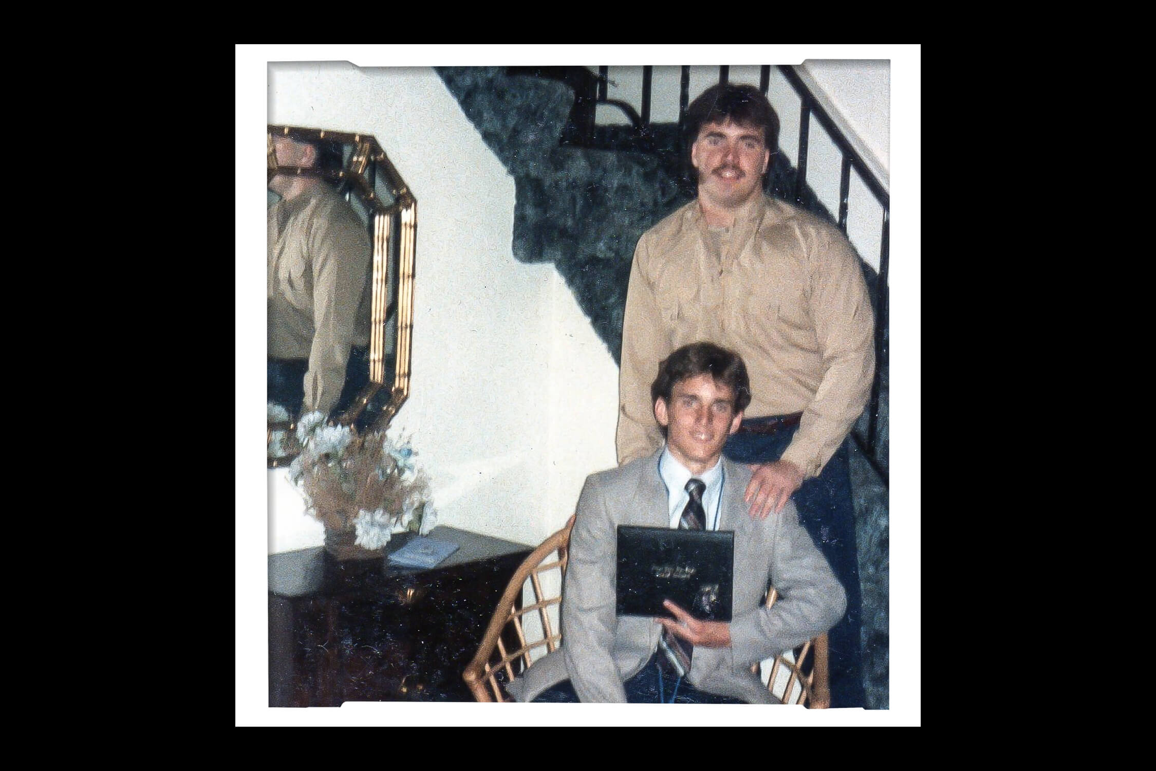 Mike McCarthy and younger brother Joe pose for a photo as young men.