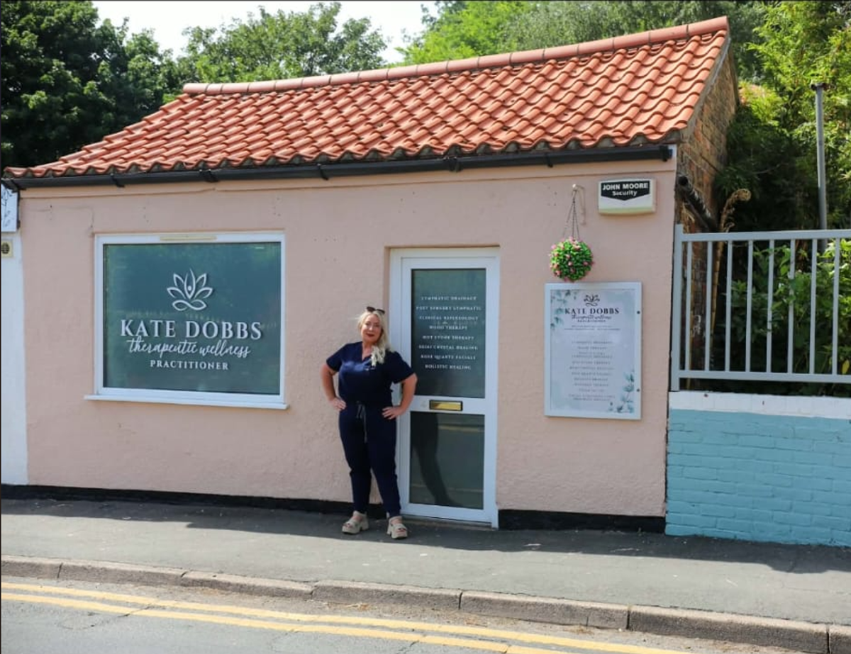 Kate Dobbs outside Kate Dobbs Therapeutic Wellness in Waltham