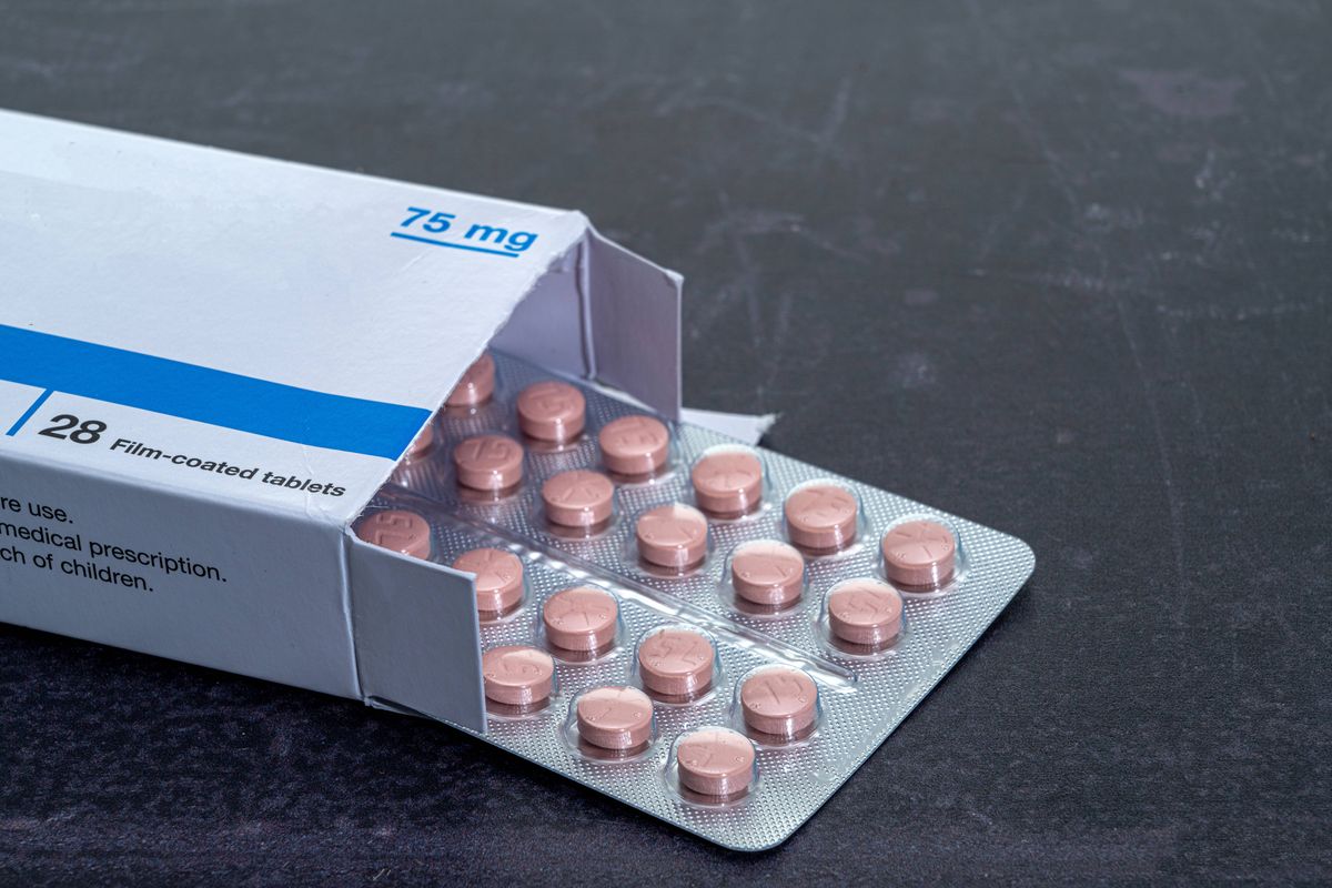 A blister pack of tablets or pills with a box
