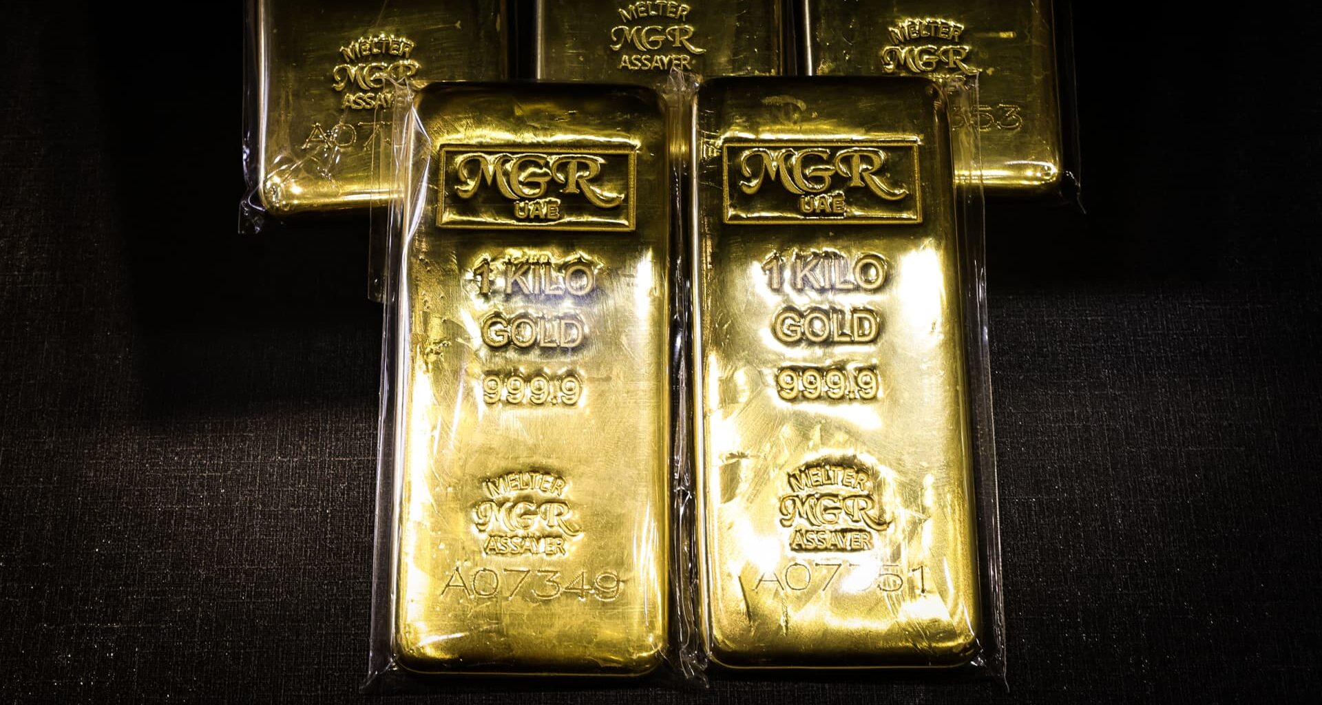 Gold slips as firm dollar weighs; focus turns to Fed meeting