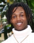 a man in a white polo-neck