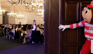 Brutus Buckeye tiptoes into a wedding at the Athletic Club of Columbus on Nov. 21, 2025.