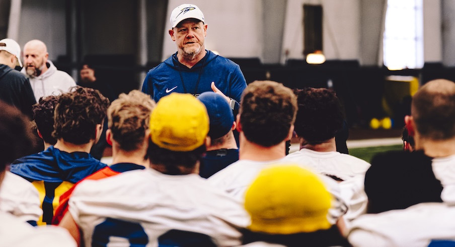 Mike Jacobs speaking to his team at a Toledo practice