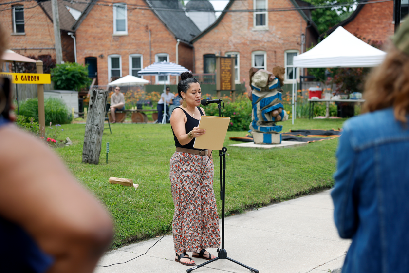 Mayda Alexandra del Valle, the second Poet Laureate of Chicago, reads one of her poems at Milton Mizenburg Jr.’s street sign unveiling ceremony on Saturday, June 27, 2026, at Oakland Museum and Garden in Oakland.