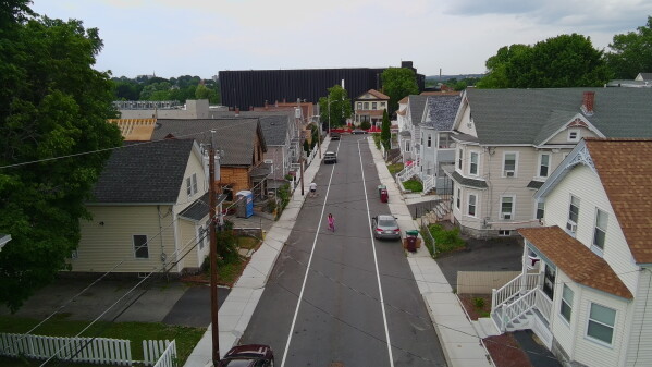 A data center built by the Markley Group looms over a residential neighborhood in Lowell, Mass., on June 30, 2026. (AP Photo/Matt O'Brien)