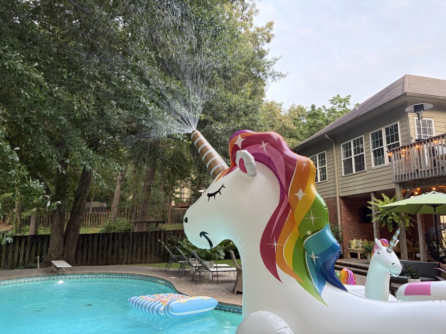 A unicorn inflatable sprinkler sprays water across Jasmine Lawson's pool in Birmingham, Ala. on June 24, 2026.