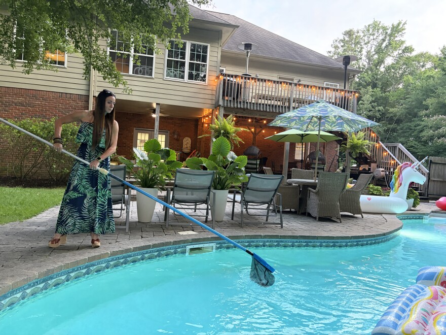 Jasmine Lawson skims her pool in Birmingham, Ala. on June 24, 2026.