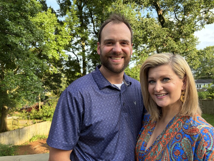 Meghan and Taylor Clopton stand in front of their backyard on June 17, 2026 in Vestavia Hills, Ala., where they hope to build their own pool one day.