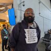Standing inside an airport, Lee Collins waits for his flight back to Atlanta from Washington, D.C., on April 28.