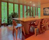 The dining room has a skylight, a soapstone serving counter, restored French doors, and a new Marvin casement window. A concealed removable wall panel allows large furniture to be moved in and out.
