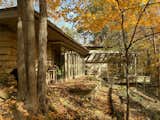 According to renovation architect Joe Kuspan, the restoration was designed to unify decades of exterior modifications while allowing old and new elements to remain distinct inside. The material palette follows the home’s 1940 design language of plywood, one-by-two pine trim, colored concrete floors, cypress, and stone.