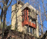 The four-story "Ivory Tower" overlooking the property was built in 1964 as a writer’s office, guesthouse, and workroom. The 845-square-foot structure retains its original colored-glass windows and includes a roughly 250-square-foot roof terrace. Connected to the carport and attached studio, it has a new roof, windows, doors, and interior framing, leaving the interior design for the next owner to complete.
