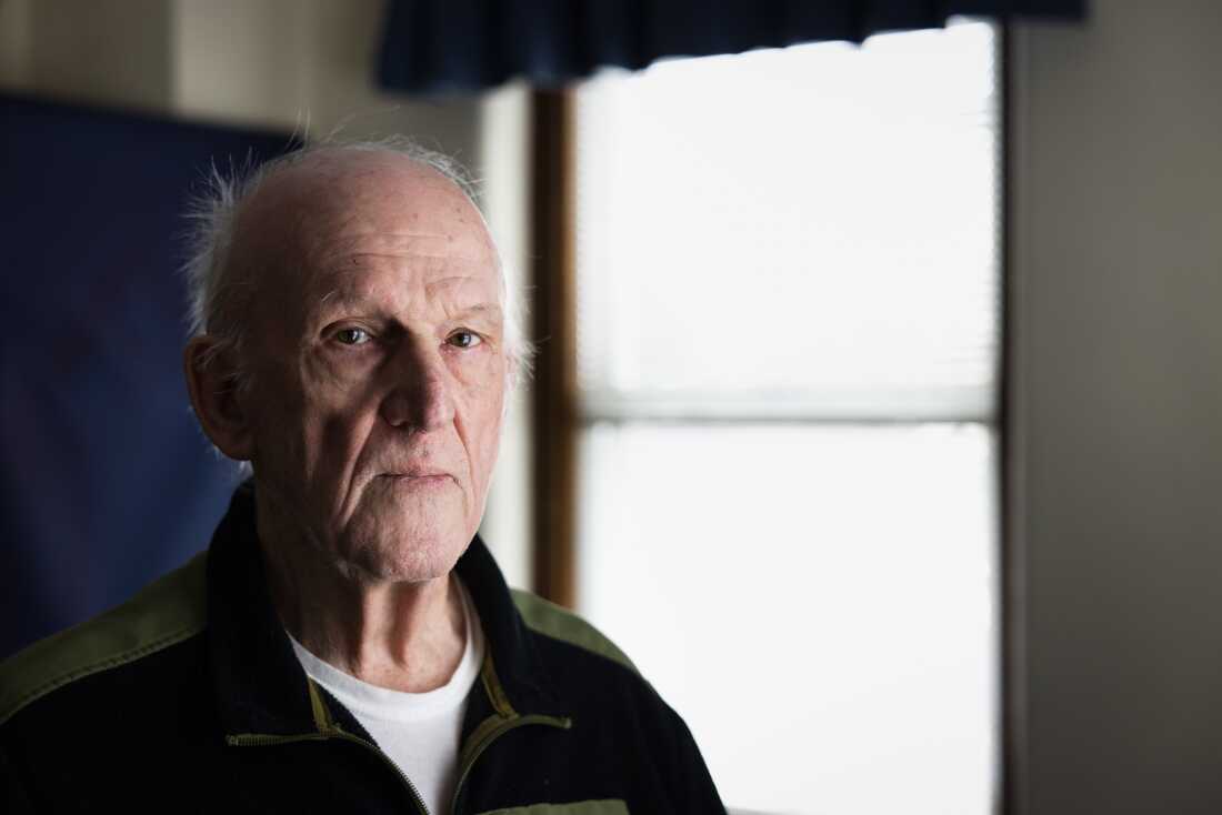 Paul Sluder is pictured standing near a window. 