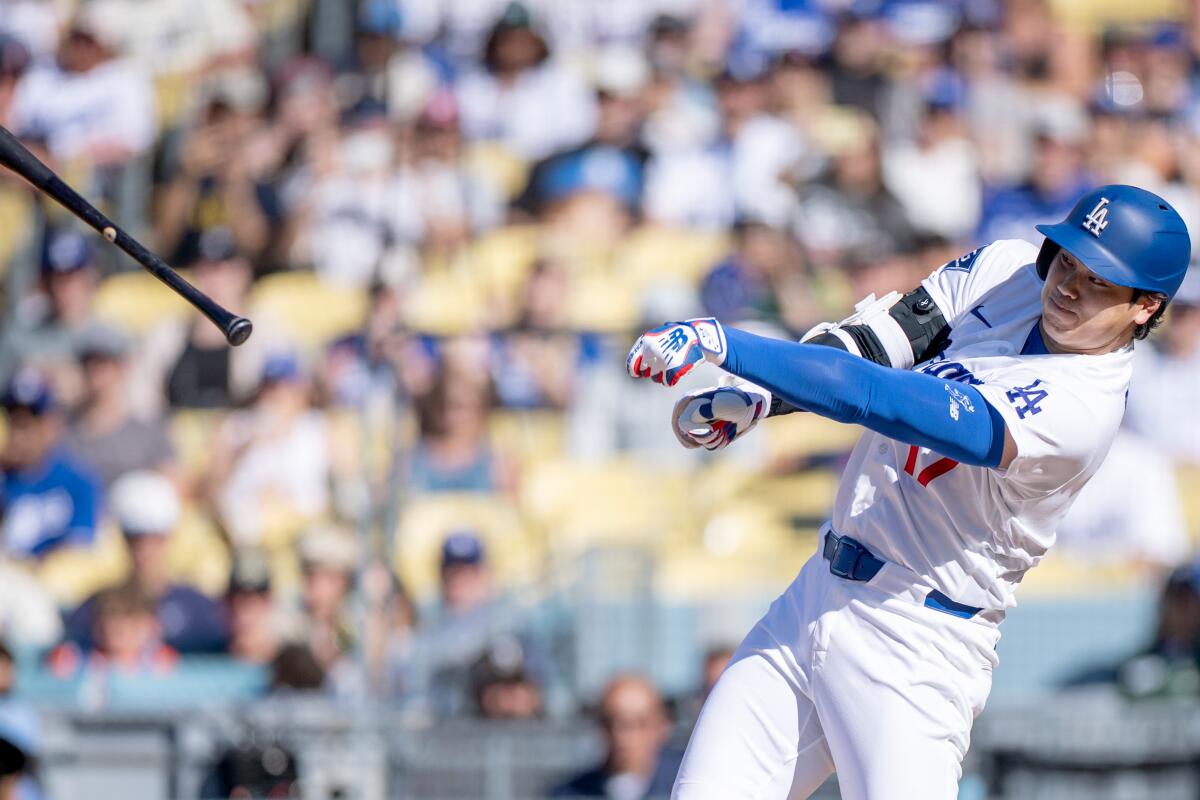 Shohei Ohtani loses his bat during the third inning Sunday.