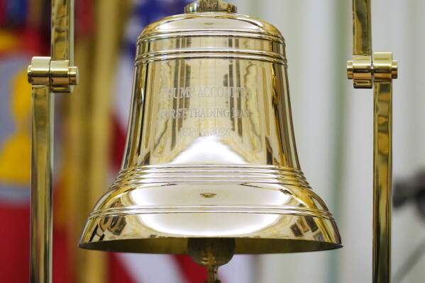 The bell sits on the Resolute Desk in the Oval Office as President Donald Trump speaks after ringing the opening bell for the New York Stock Exchange and the Nasdaq at the White House, Monday, July 6, 2026, in Washington. (AP Photo/Mark Schiefelbein)