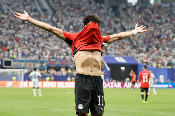 Egypt's Mostafa Zico (11) celebrates scoring their first goal during the World Cup round of 16 soccer match between Argentina and Egypt in Atlanta, Tuesday, July 7, 2026. (AP Photo/Erik S. Lesser)