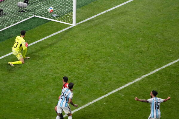 Egypt goalkeeper Mostafa Shoubir (23) looks back as Argentina's Enzo Fernandez (24) scores their third goal during the World Cup round of 16 soccer match between Argentina and Egypt in Atlanta, Tuesday, July 7, 2026. (AP Photo/Chris Carlson)