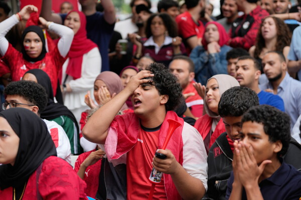Egyptian fans react while watching a World Cup soccer game between Egypt and Argentina, in New York, Tuesday, July 7, 2026. (AP Photo/Seth Wenig)