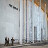 The Kennedy Center on June 28, with its facade signage still covered by a tarp and scaffolding.