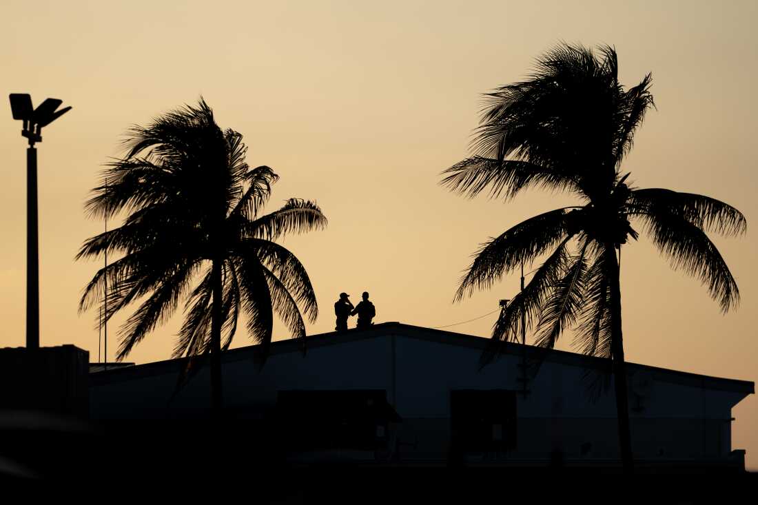 Members of the U.S. Secret Service stand by ahead of Trump's arrival at Palm Beach International Airport in February.