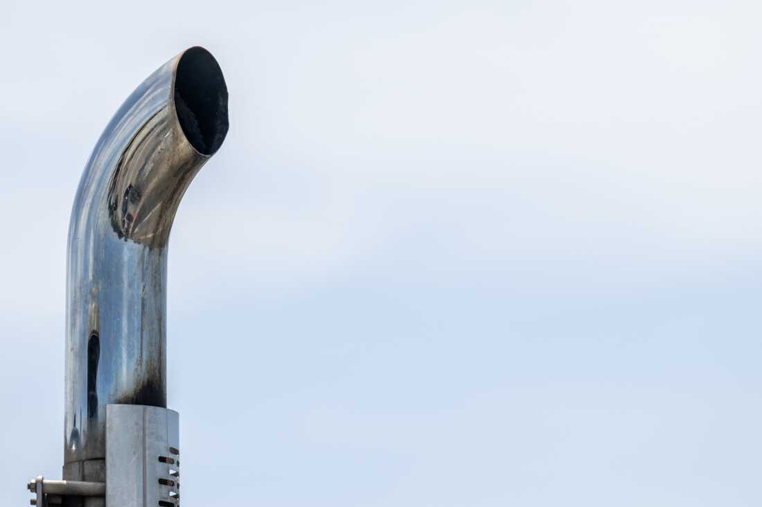 An exhaust pipe is pictured atop a truck traveling along Interstate 35 on July 30, 2025 in Austin, Texas. The EPA is proposing changes to rule limiting hazardous pollution from heavy trucks.