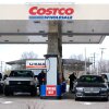 Drivers fuel up at a Costco gas station in Roseville, Mich.