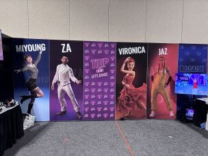Trip the Light's booth at the Augmented World Expo included posters of the app's virtual instructors. Real-life performers, who gave Trip the Light permission to motion capture their movements, were used as a basis for these avatars.