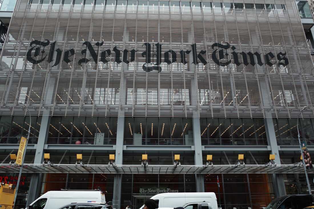 The New York Times says federal agents showed up at several of its journalists' homes Friday night to try to force them to testify before a grand jury next week.