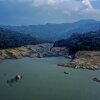 Forecasters are warning that a new El Niño weather pattern could bring strong impacts to areas around the world. In this 2024 photo, dramatically low water levels are seen in a reservoir feeding the Guavio Hydroelectric Power Plant in Gachalá, in Colombia's Guavio Province, during dry conditions linked to El Niño.