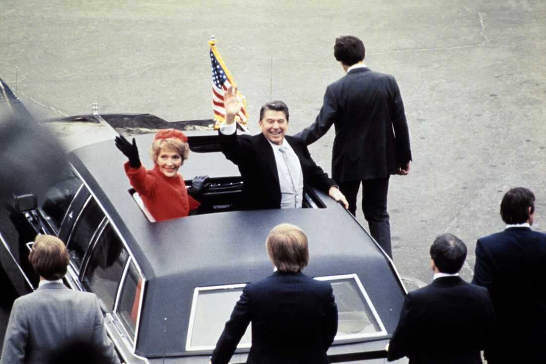 Ronald Reagan salutes beside his wife Nancy Reagan during his 1981 inaugural ceremony in Washington, D.C.