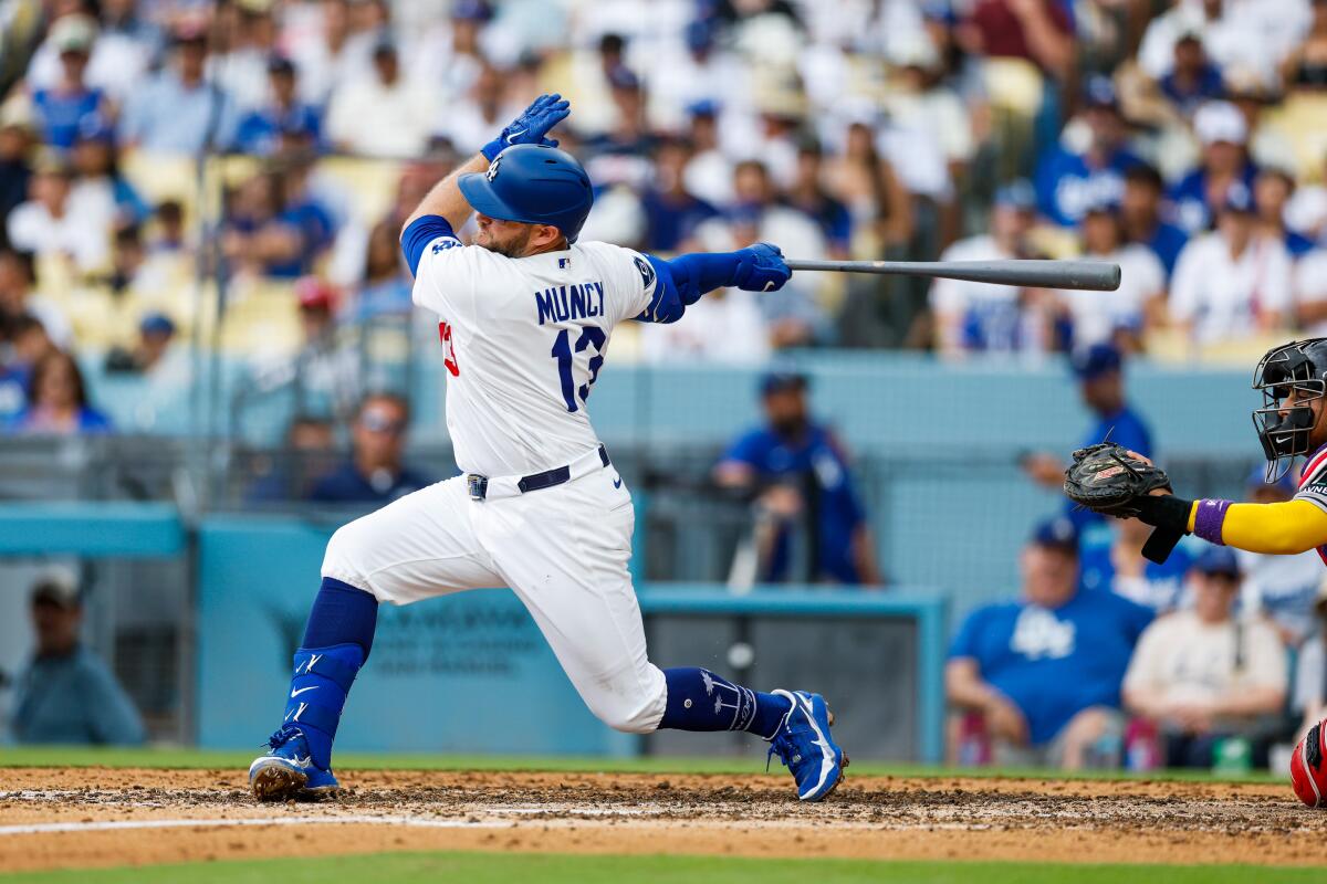 Max Muncy swings at a pitch in the seventh inning.