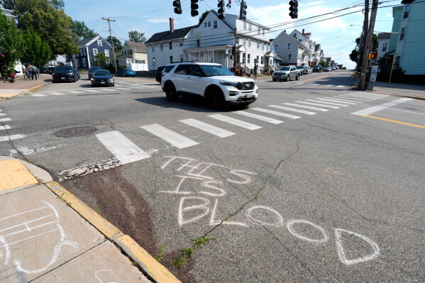Blood is seen on the pavement near the scene of a shooting involving U.S. Immigration and Customs Enforcement, Monday, July 13, 2026 in Biddeford, Maine. (AP Photo/Robert F. Bukaty)