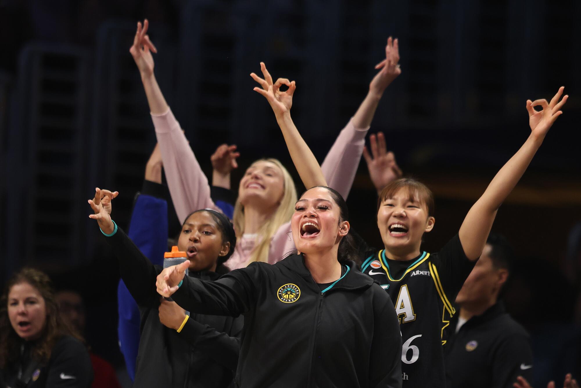 Players on the Sparks' bench celebrate during a win over the Chicago Sky at Crypto.com Arena on July 10.