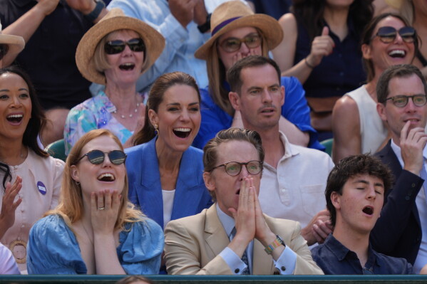 Britain's Kate, Princess of Wales, laughs next to former tennis player Andy Murray as they watch the second round women's singles match between Katie Swan of Britain and Madison Keys of the United States, at the Wimbledon Tennis Championships in London, Thursday, July 2, 2026. (AP Photo/Maja Smiejkowska)