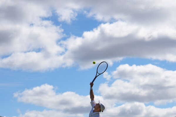 Otto Virtanen of Finland serves during the second round men's singles match against Arthur Fery of Britain at the Wimbledon Tennis Championships in London, Thursday, July 2, 2026.(AP Photo/Kin Cheung)