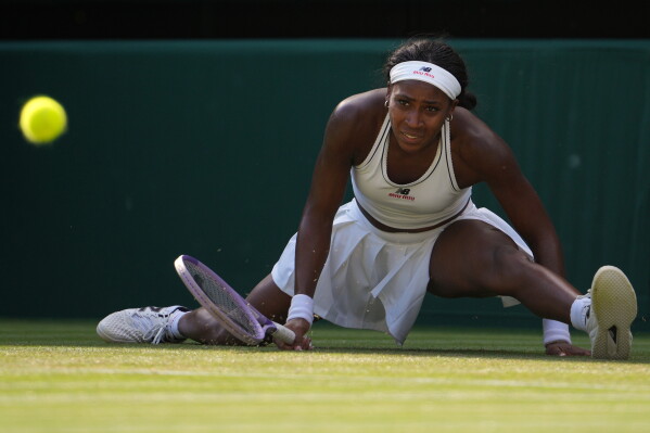Coco Gauff of the United States eyes the ball during a point against Solana Sierra of Argentina in their second round women's singles match at the Wimbledon Tennis Championships in London, Wednesday, July 1, 2026. (AP Photo/Kin Cheung)