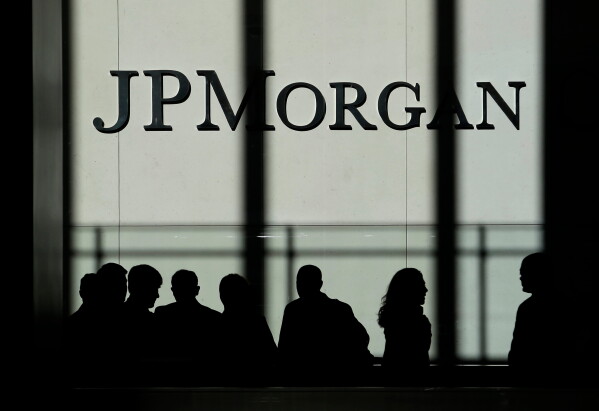 In this Monday, Oct. 21, 2013, file photo, the JPMorgan Chase & Co. logo is displayed at their headquarters in New York. (AP Photo/Seth Wenig, File)