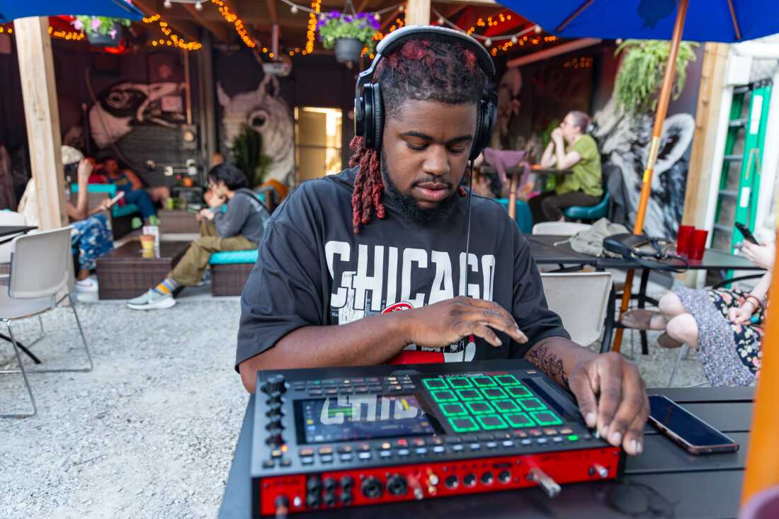 Flip a Beat Club Chicago (FABC) chapter participant and artist Ace makes beats using their MPC (or "beat machine") at the bar and art space Nighthawk in Chicago, Illinois.