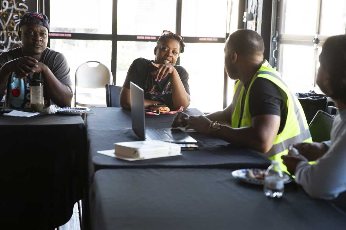 Latara Sutton shares her thoughts during the weekly Inner-City Muslim Action Network (IMAN) organizing committee meeting at IMAN headquarters on July 8 in Chicago.